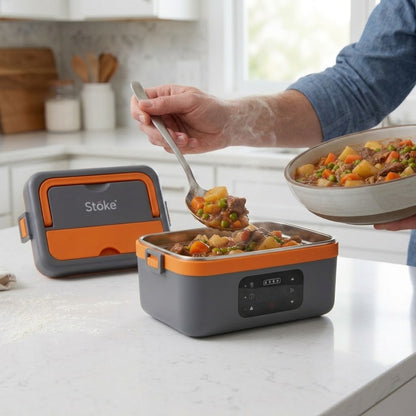 Person serving a hot beef stew meal from the Stoke Co. cordless heated meal box onto a plate on a kitchen counter
